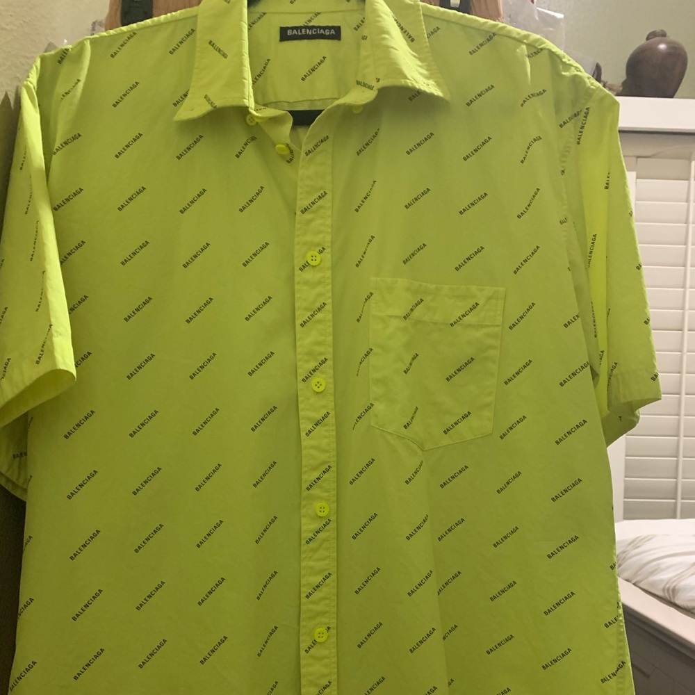 Balenciaga short sleeve all over print logo shirt.